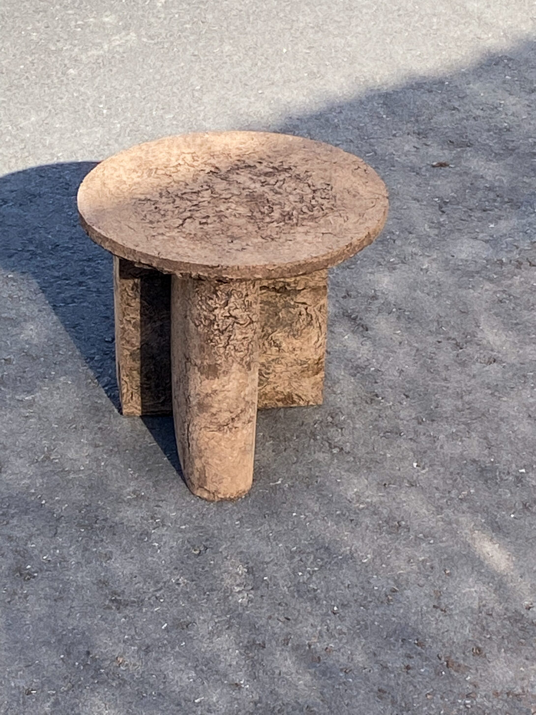 side table made from rough natural material called euca wood